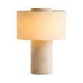 Lampe Vesta en pierre dorée (travertin) avec abat-jour rond, sur fond blanc