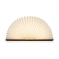 Lampe de bureau enfant Conte, livre en bois ouvert en éventail lumineux, finition noyer, sur fond blanc — Candeora