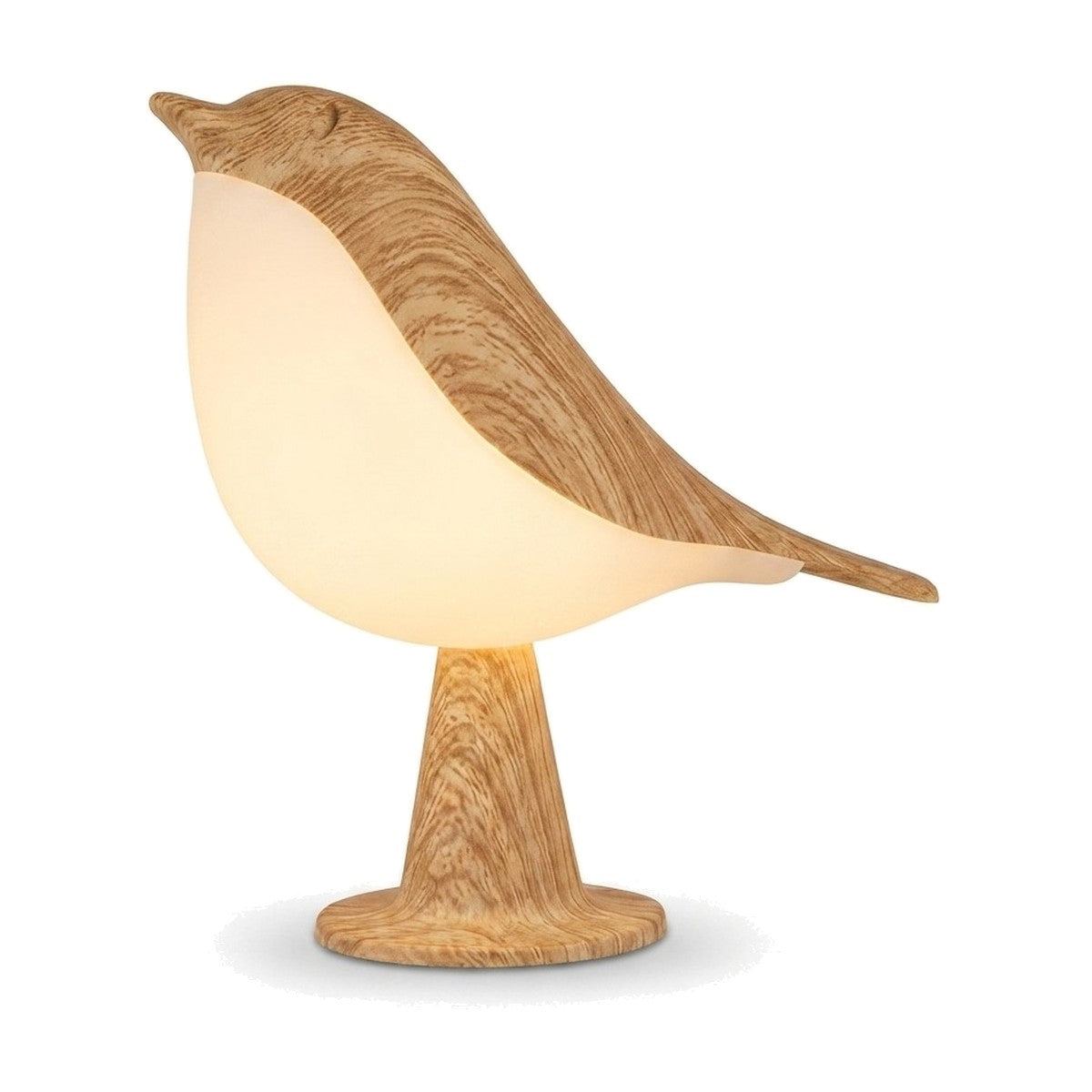 Lampe de bureau enfant Piou, veilleuse en forme d'oiseau à finition effet bois, allumée sur fond blanc — Candeora