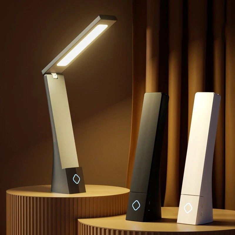 Les trois finitions de la lampe de bureau sans fil Brise Candeora : noire, gris taupe et blanc crème